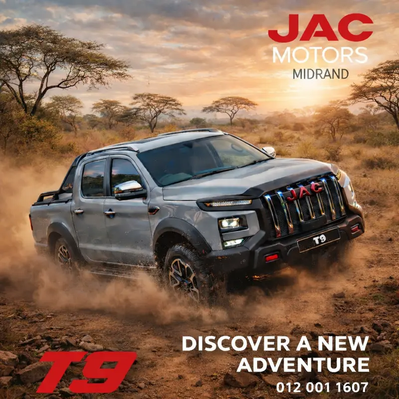 Silver JAC T9 bakkie driving through a dusty savannah trail at sunset in South Africa.