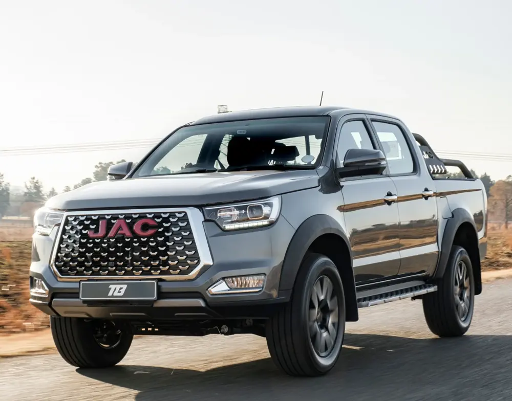 Grey JAC T8 Double Cab 4x4 Lux bakkie driving on a road, available at JAC Midrand, Gauteng.