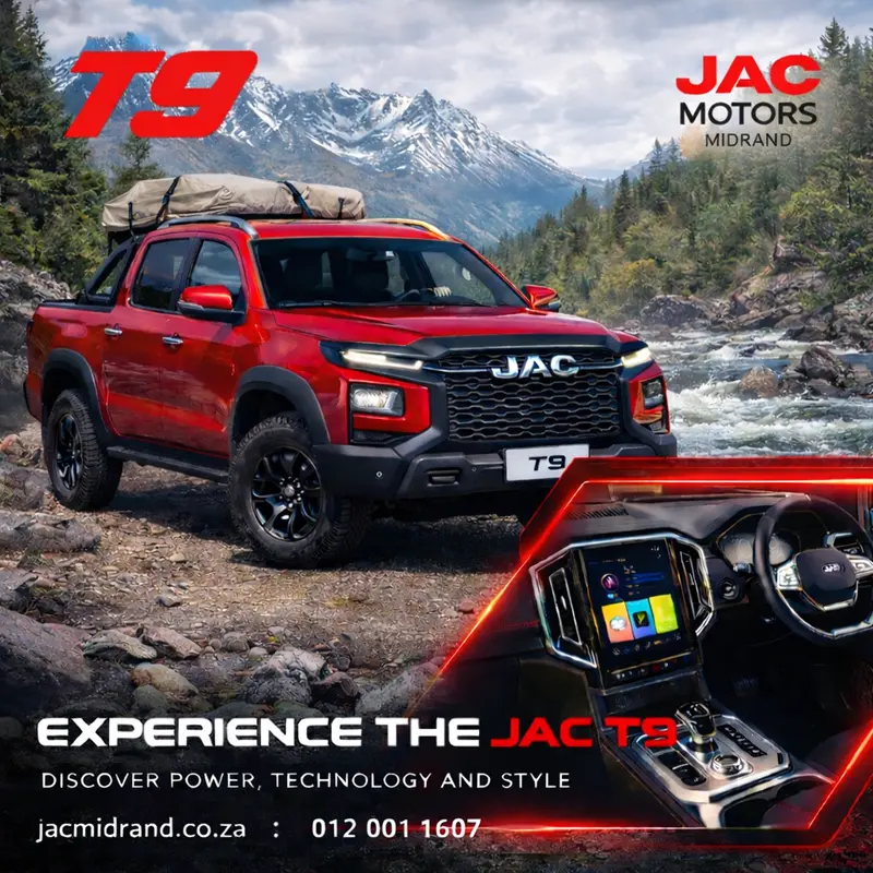 A red JAC T9 double cab with a roof-top tent parked by a mountain river, showcasing its overlanding capabilities.